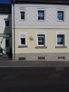 Sonne aus Messing, die Hausnummer ist aus Kupfer