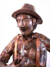 Personenskulptur, sogar in der Pfeife ist noch der Tabak aus Kupfer