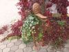 Comicfigur als Blumentopf (rostendes Stahlblech)